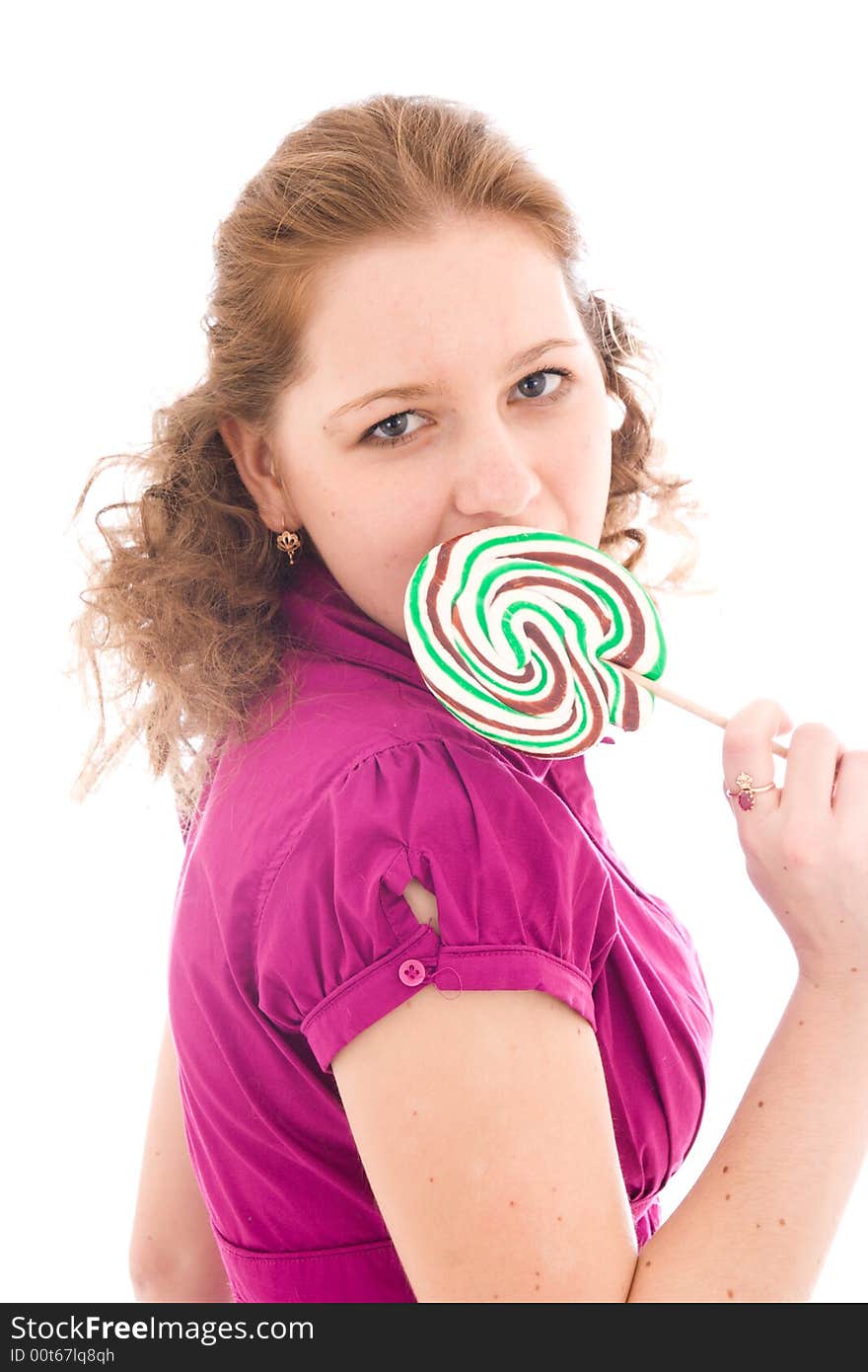 The girl with a sugar candy isolated on a white background