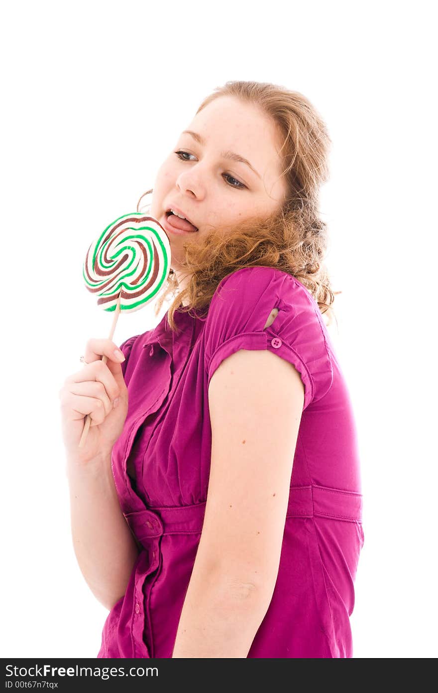 The girl with a sugar candy isolated on a white