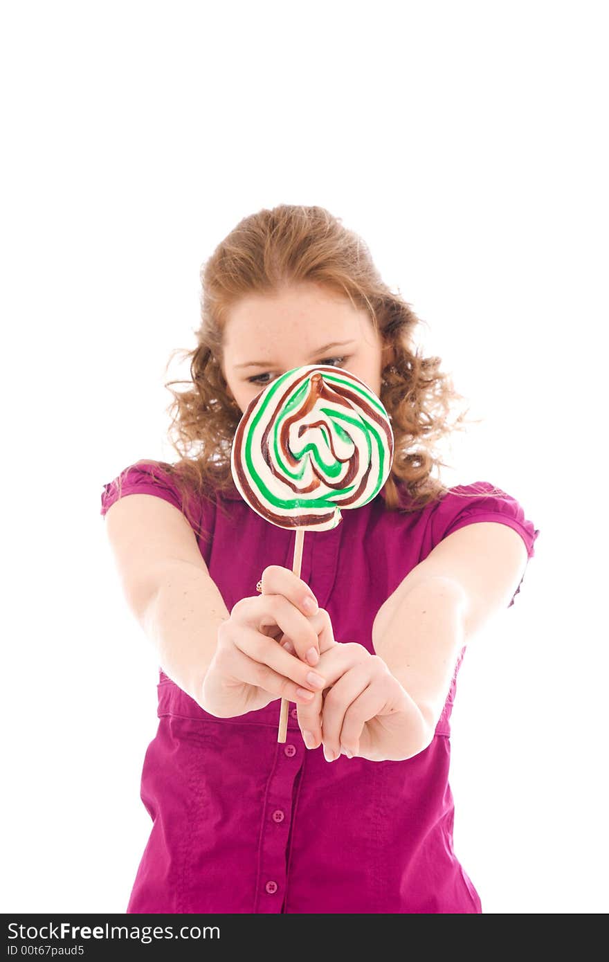 The girl with a sugar candy isolated on a white background