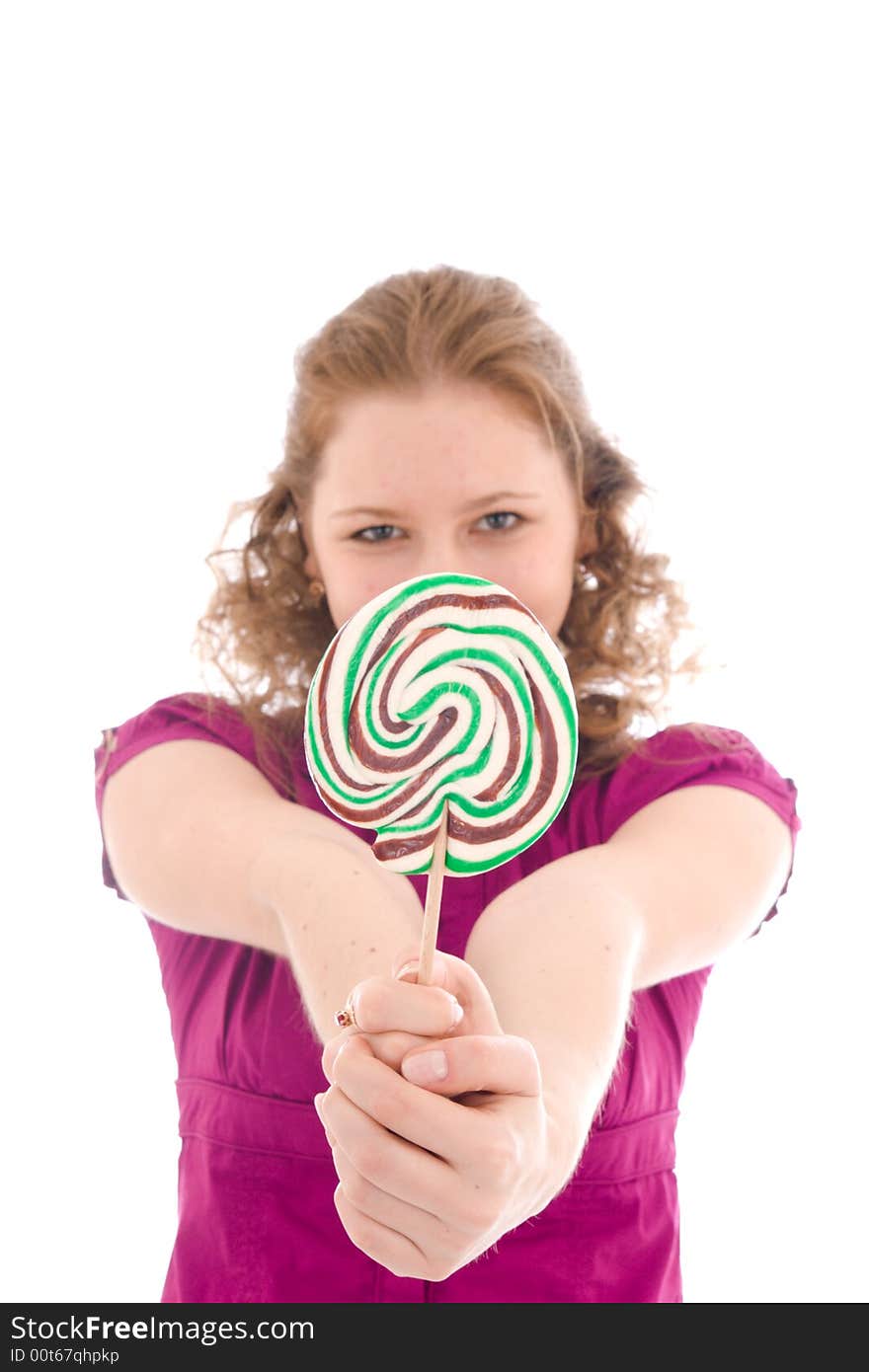 The girl with a sugar candy isolated on a white background