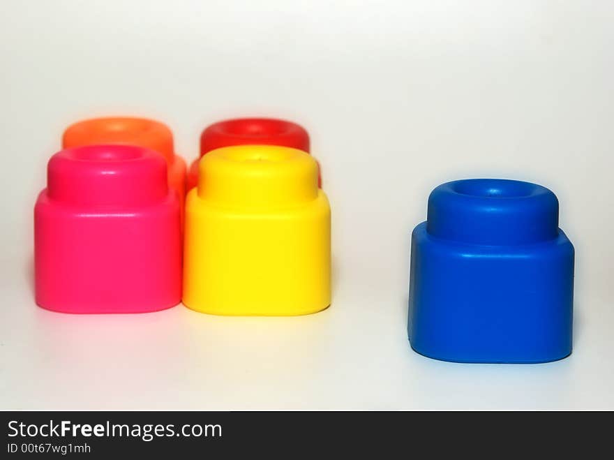 Coloured building blocks on white background