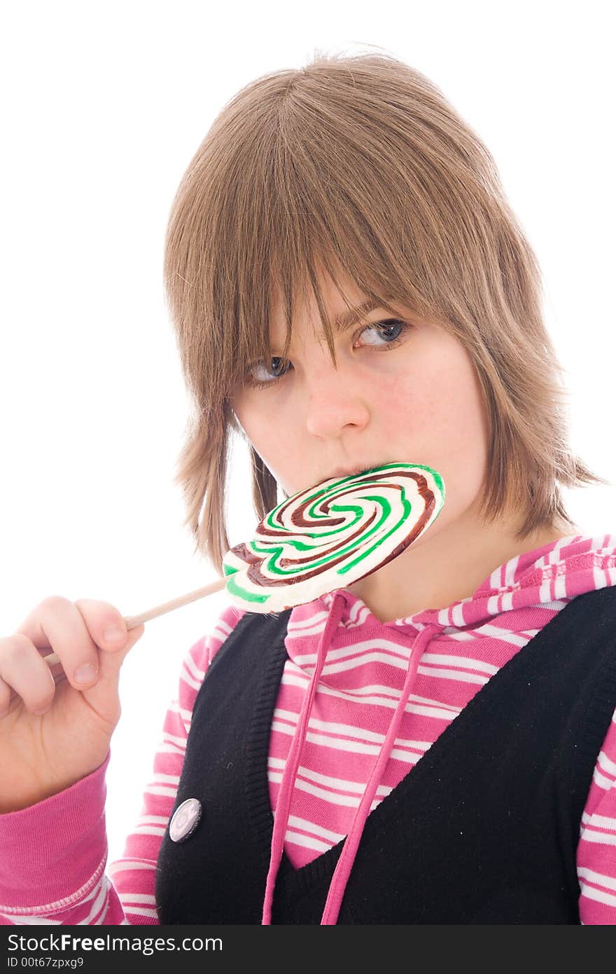 The girl with a sugar candy isolated on a white background