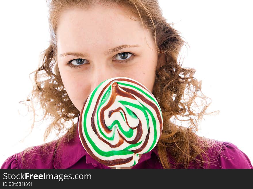 The girl with a sugar candy isolated on a white background