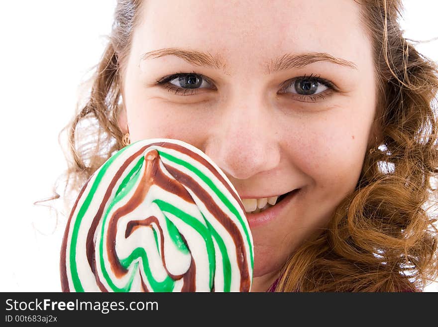 The girl with a sugar candy isolated on a white