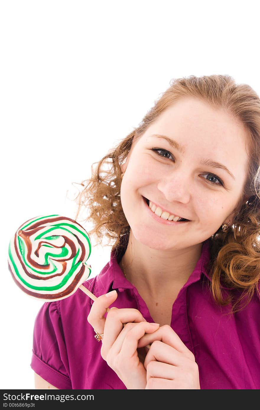 The girl with a sugar candy isolated on a white background