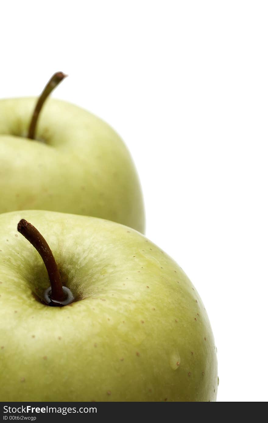 Two delicious green apples on white background. Two delicious green apples on white background