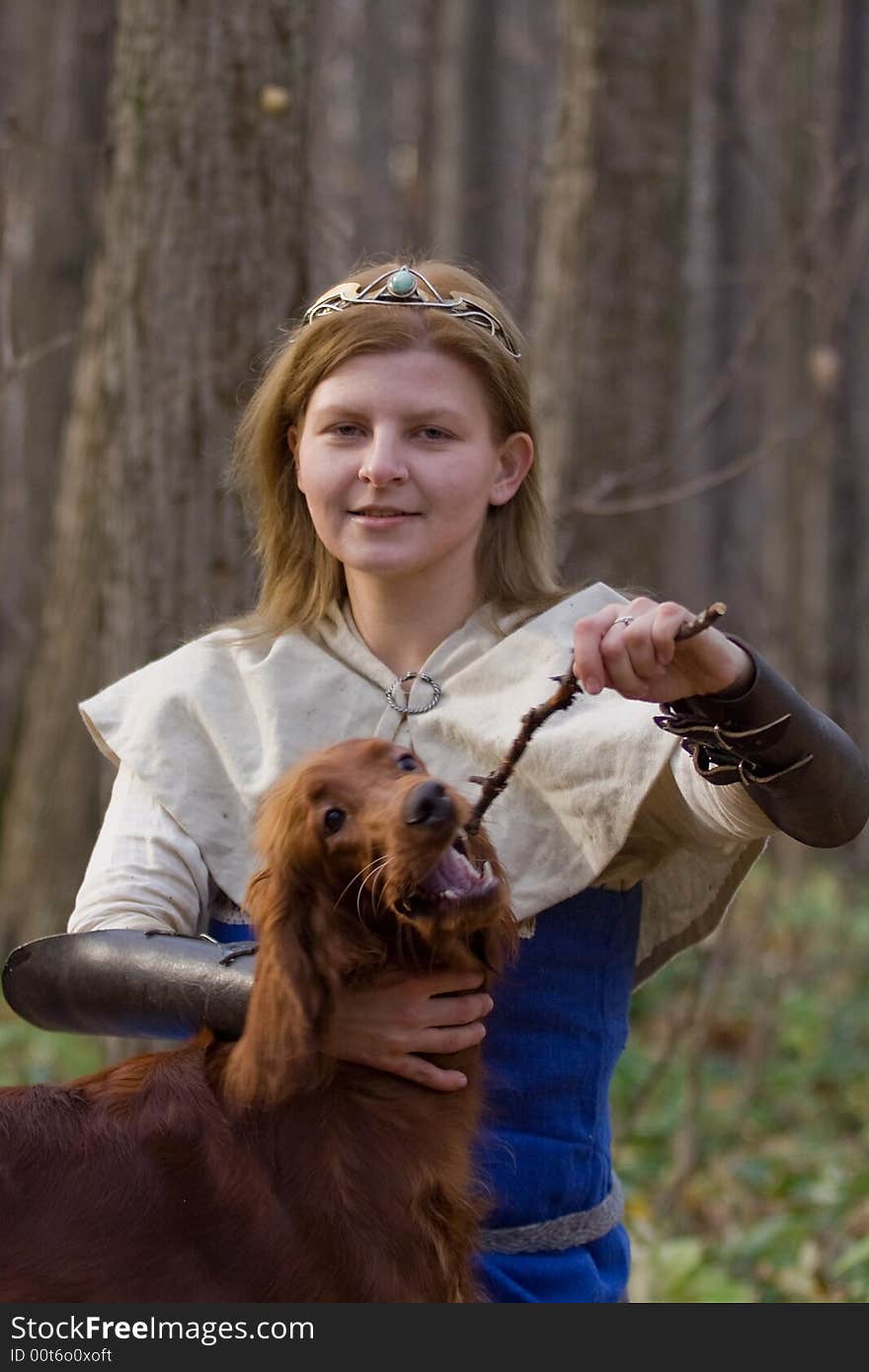 Portrait of the girl and irish setter in autumn forest. Portrait of the girl and irish setter in autumn forest.