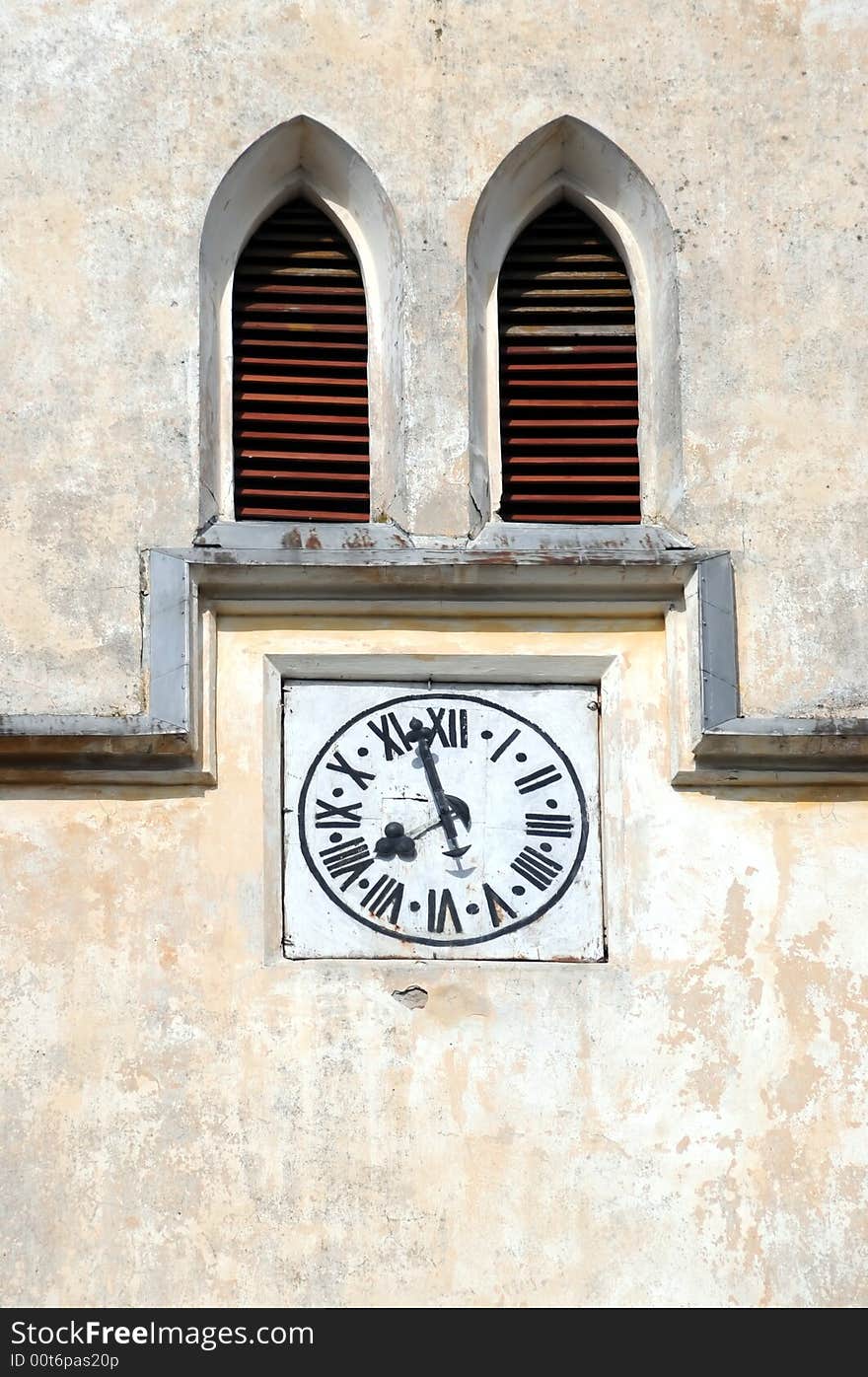 A view with a watch on church tower. A view with a watch on church tower