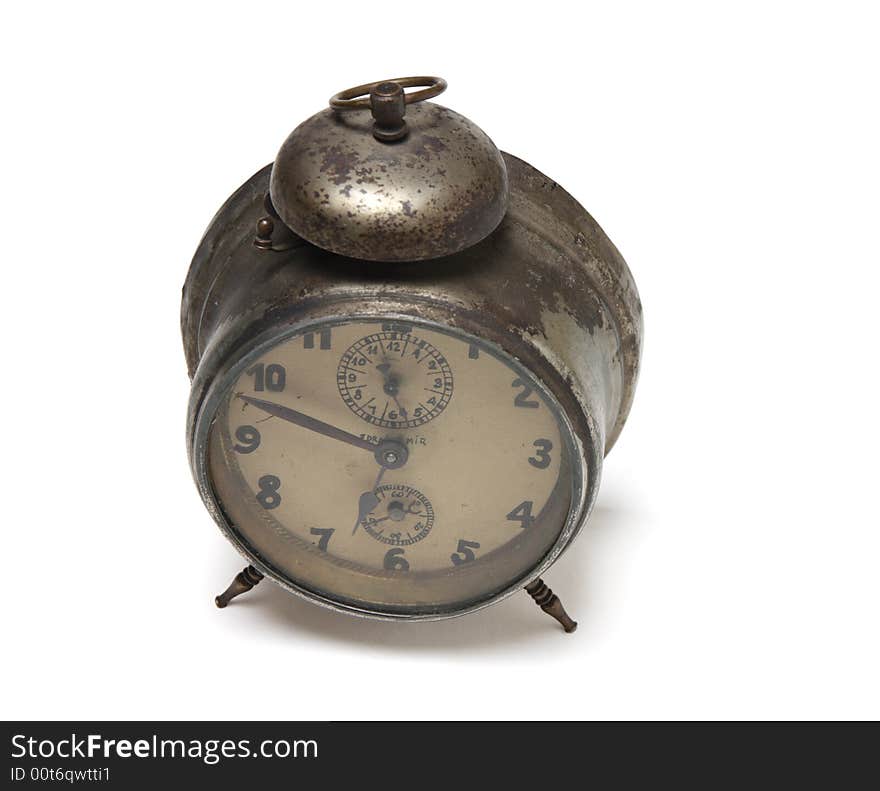 An old rusty alarm-clock with its handmade face. An old rusty alarm-clock with its handmade face.