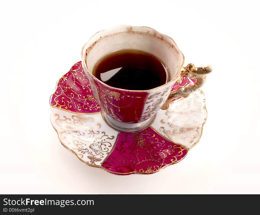 A cup of Turkish coffee, served with old porcelain cup. A cup of Turkish coffee, served with old porcelain cup.