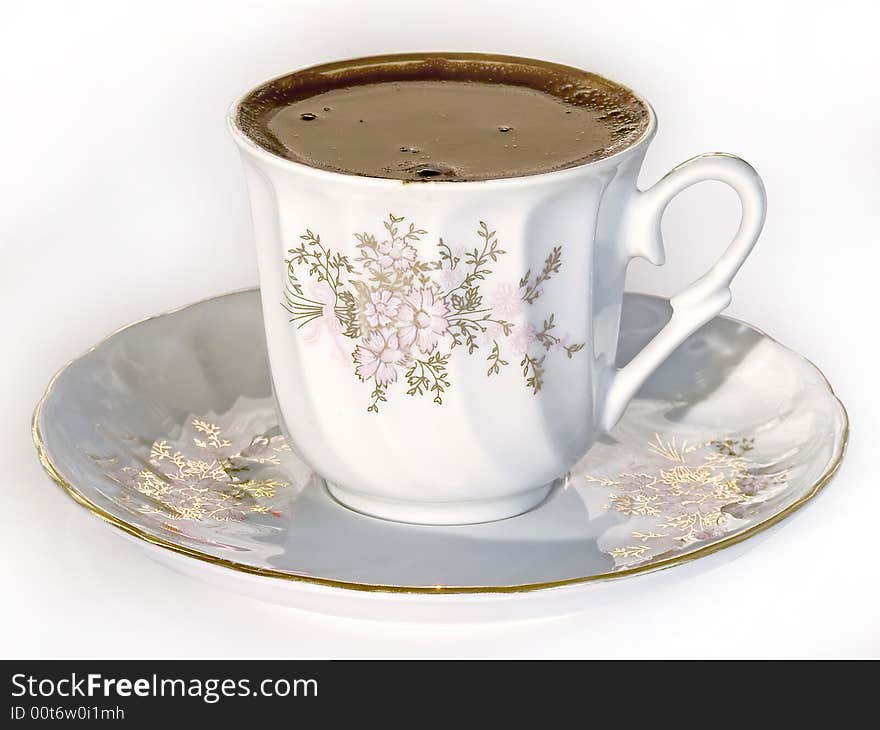 A cup of Turkish coffee, served with old porcelain cup. A cup of Turkish coffee, served with old porcelain cup.