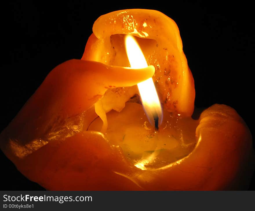 Wax from left side looks like arm trying to protect the flame. Wax from left side looks like arm trying to protect the flame.