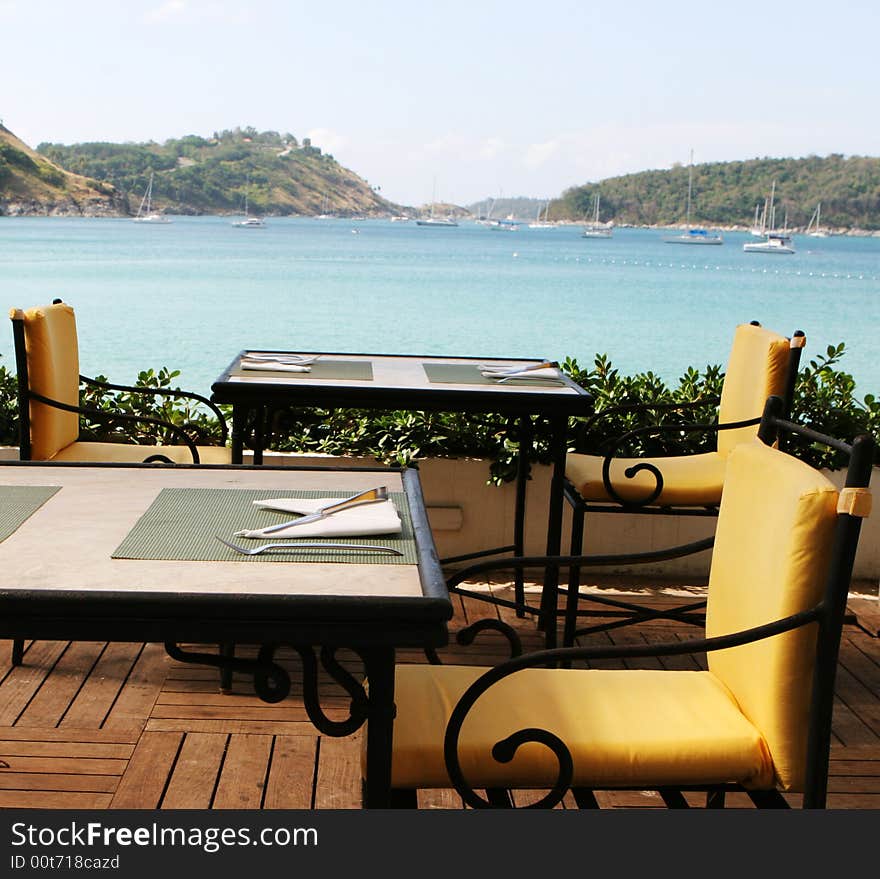 Table at a restaurant overlooking ocean views. Table at a restaurant overlooking ocean views.