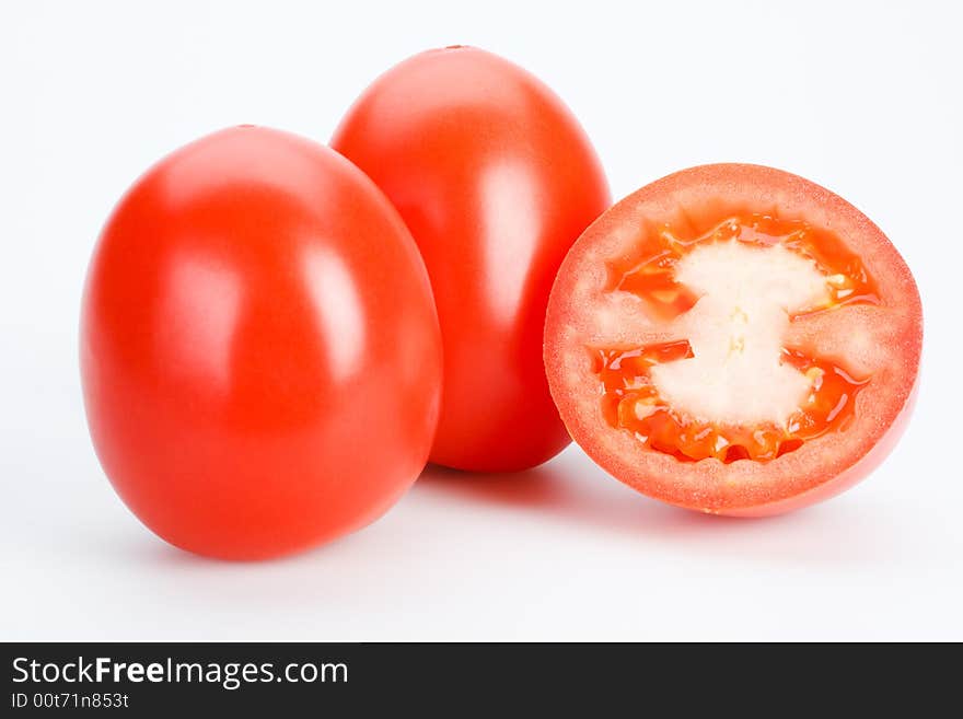 Red tomatoes on white background, isolated