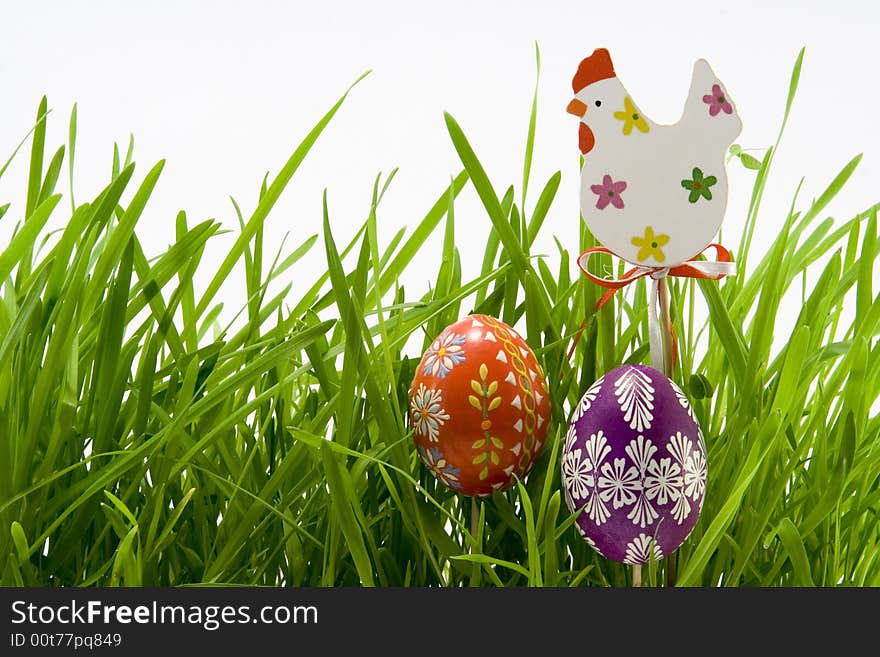 The easter eggs and hen in grass. The easter eggs and hen in grass