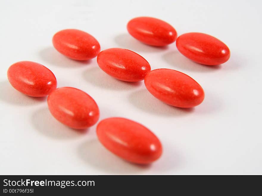 A few medicine tablets on a table