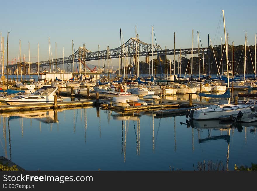 Marina next to Bay Bridge in San Francisco at sunset