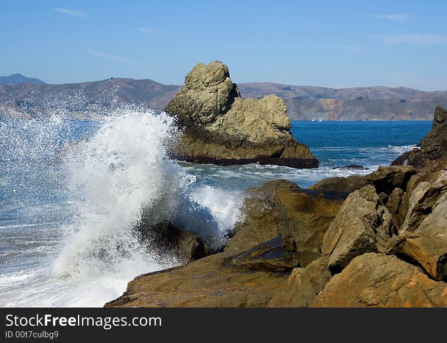 Waves crashing against the rocks