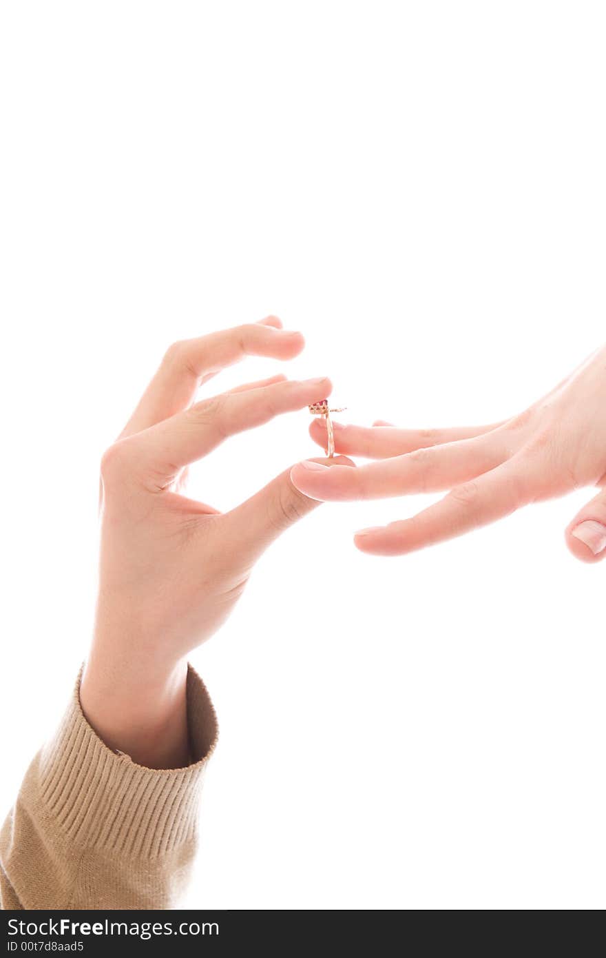 Two hands with a ring isolated on a white background