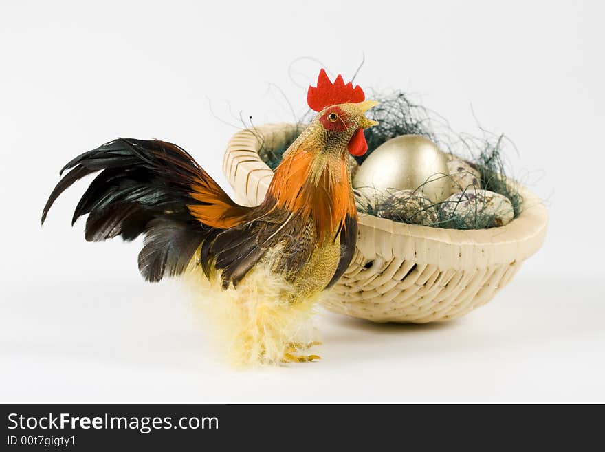 Cock and eggs in a nest