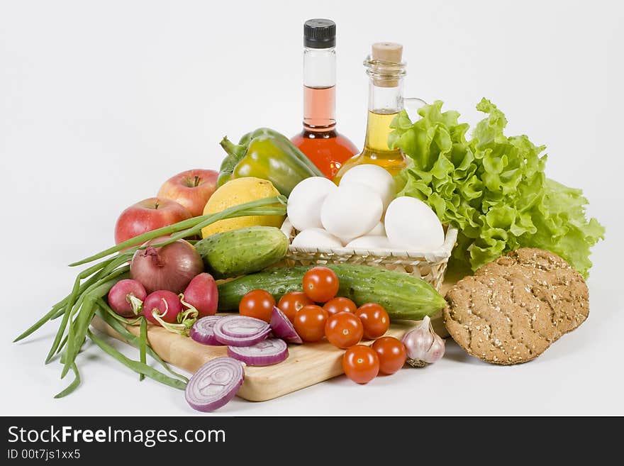 Still-life with vegetables isolated on a white background. Still-life with vegetables isolated on a white background.