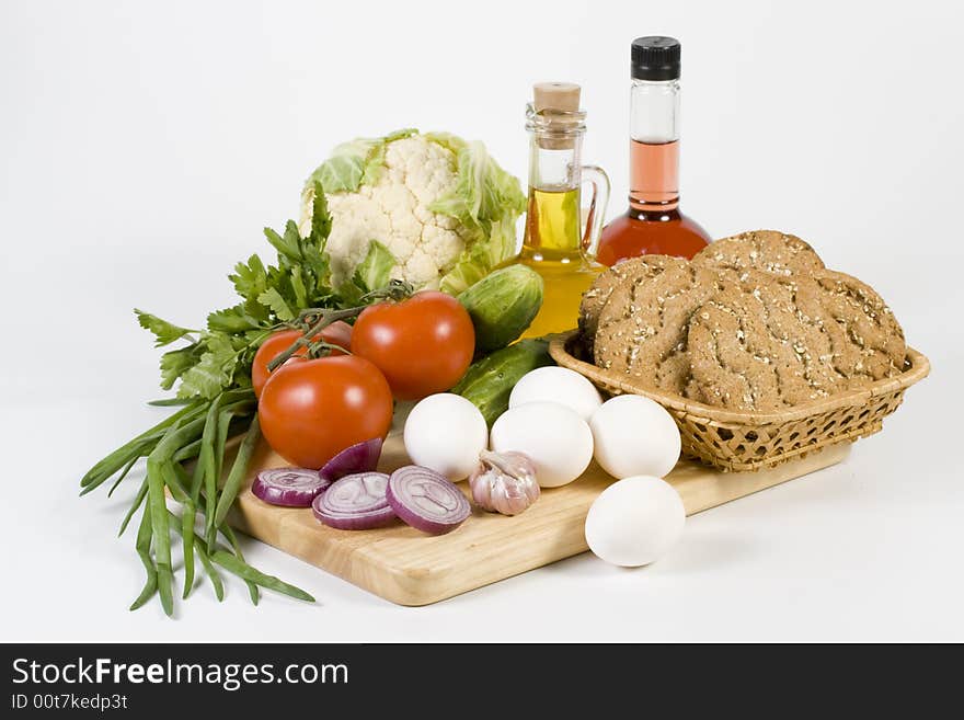 Still-life with vegetables isolated on a white background. Still-life with vegetables isolated on a white background.