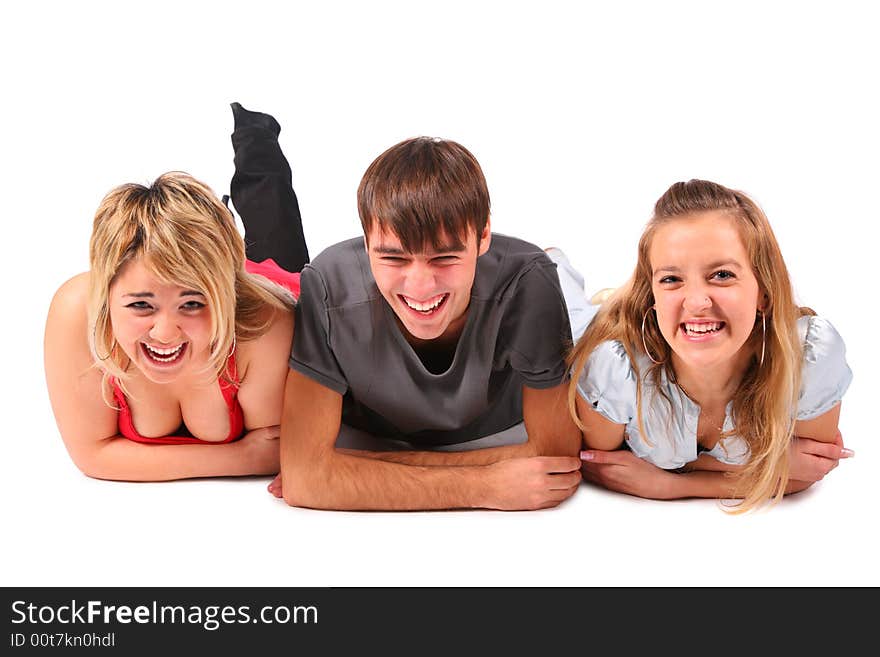 Boy and two girls lying on white