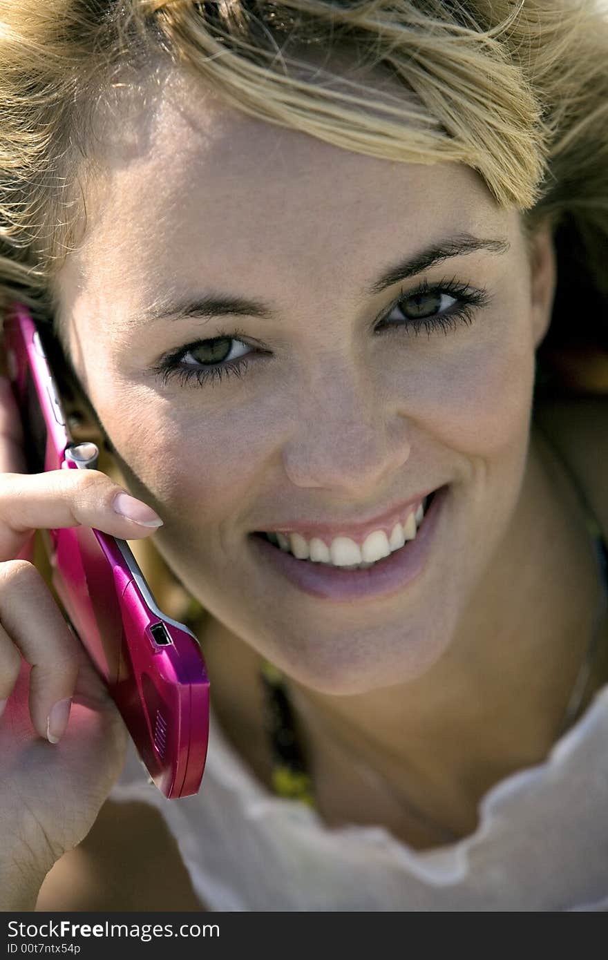 Smiling Woman Holding A Mobile Phone