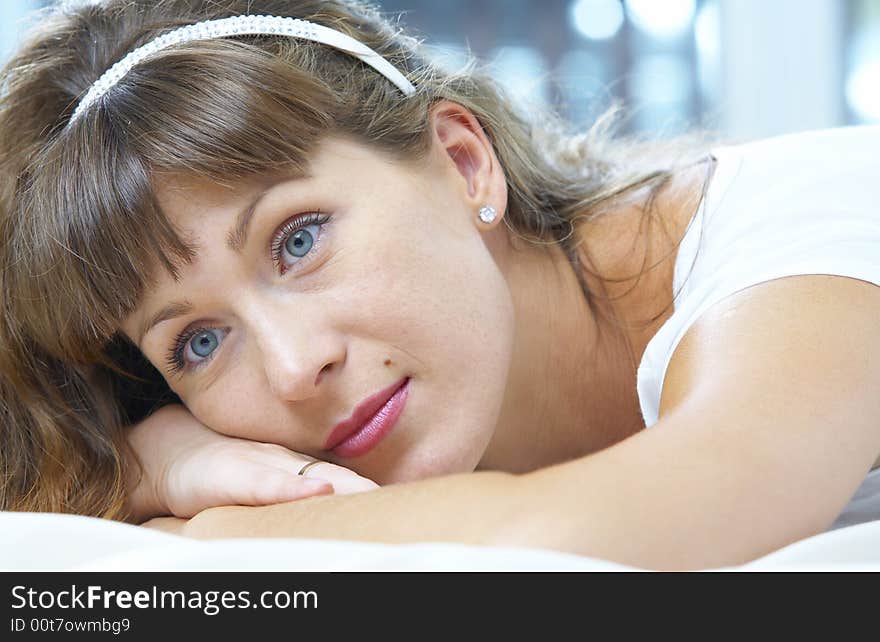 High key portrait of young woman in her bedroom. High key portrait of young woman in her bedroom