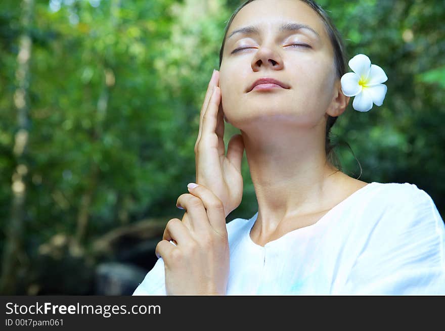 Portrait of fresh and beautiful human with flower in summer environment. Portrait of fresh and beautiful human with flower in summer environment