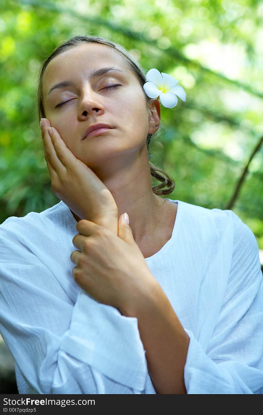 Portrait of fresh and beautiful human with flower in summer environment. Portrait of fresh and beautiful human with flower in summer environment