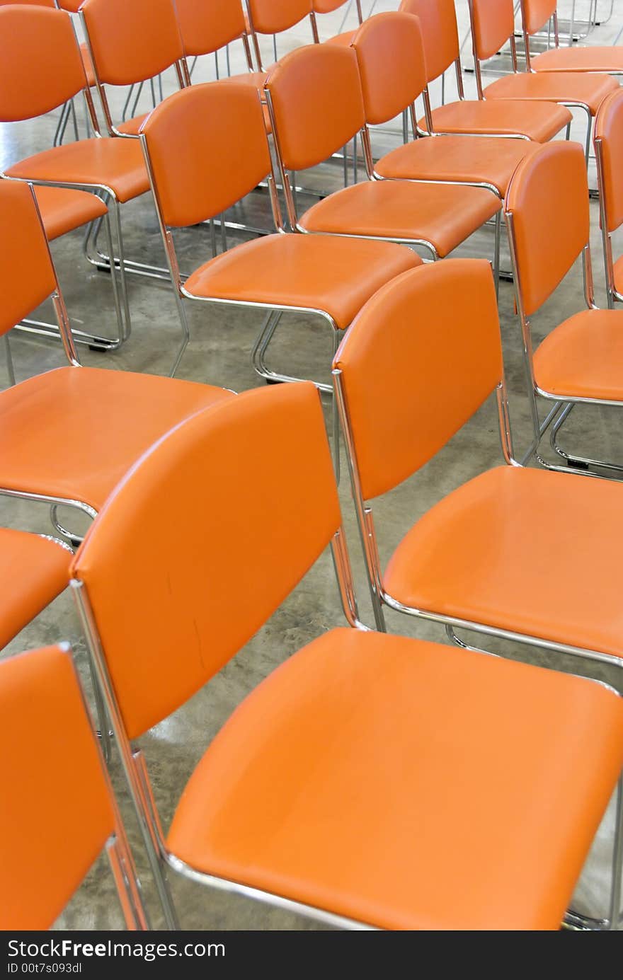 A long row of orange chairs