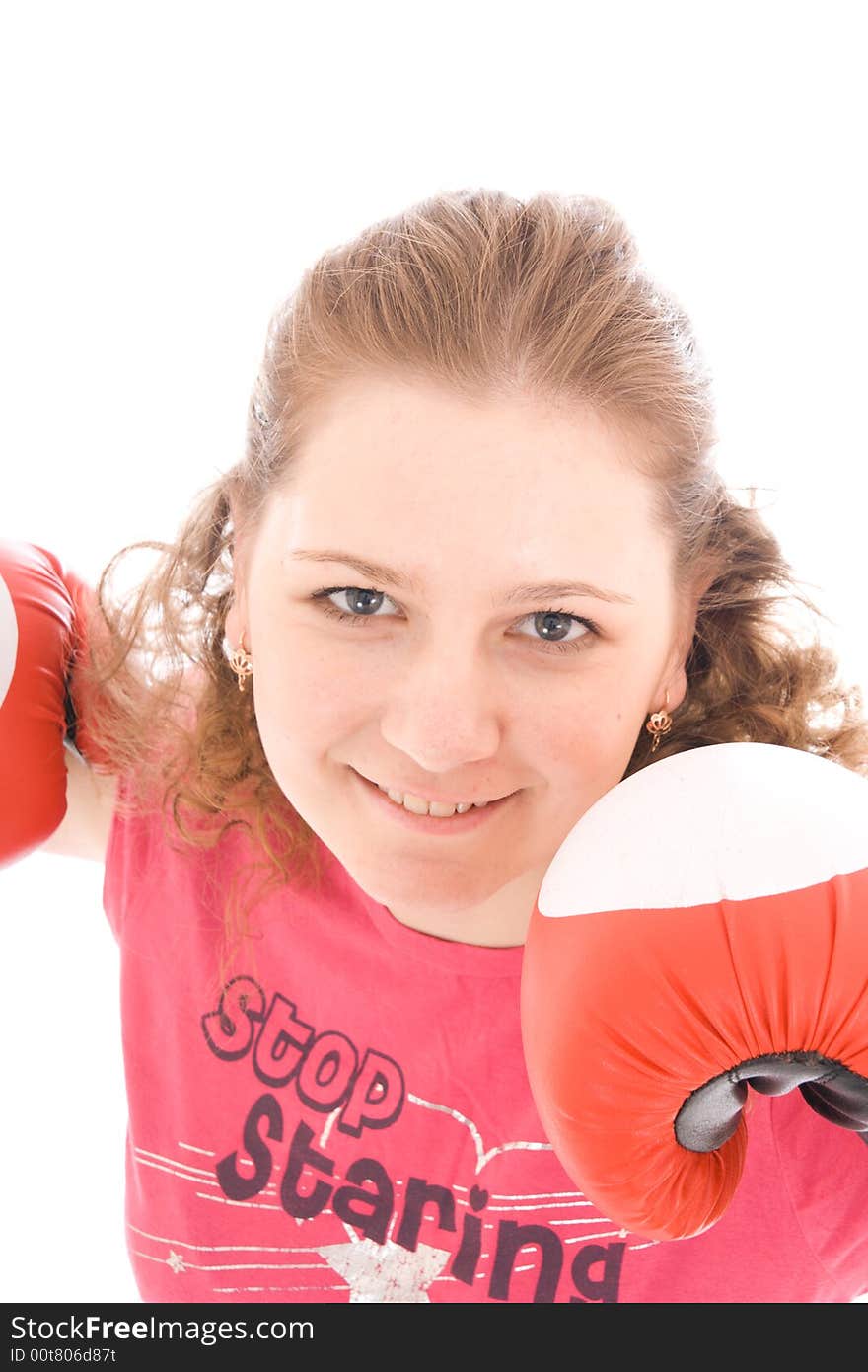 The young beautiful girl with boxing gloves isolated on a white background. The young beautiful girl with boxing gloves isolated on a white background