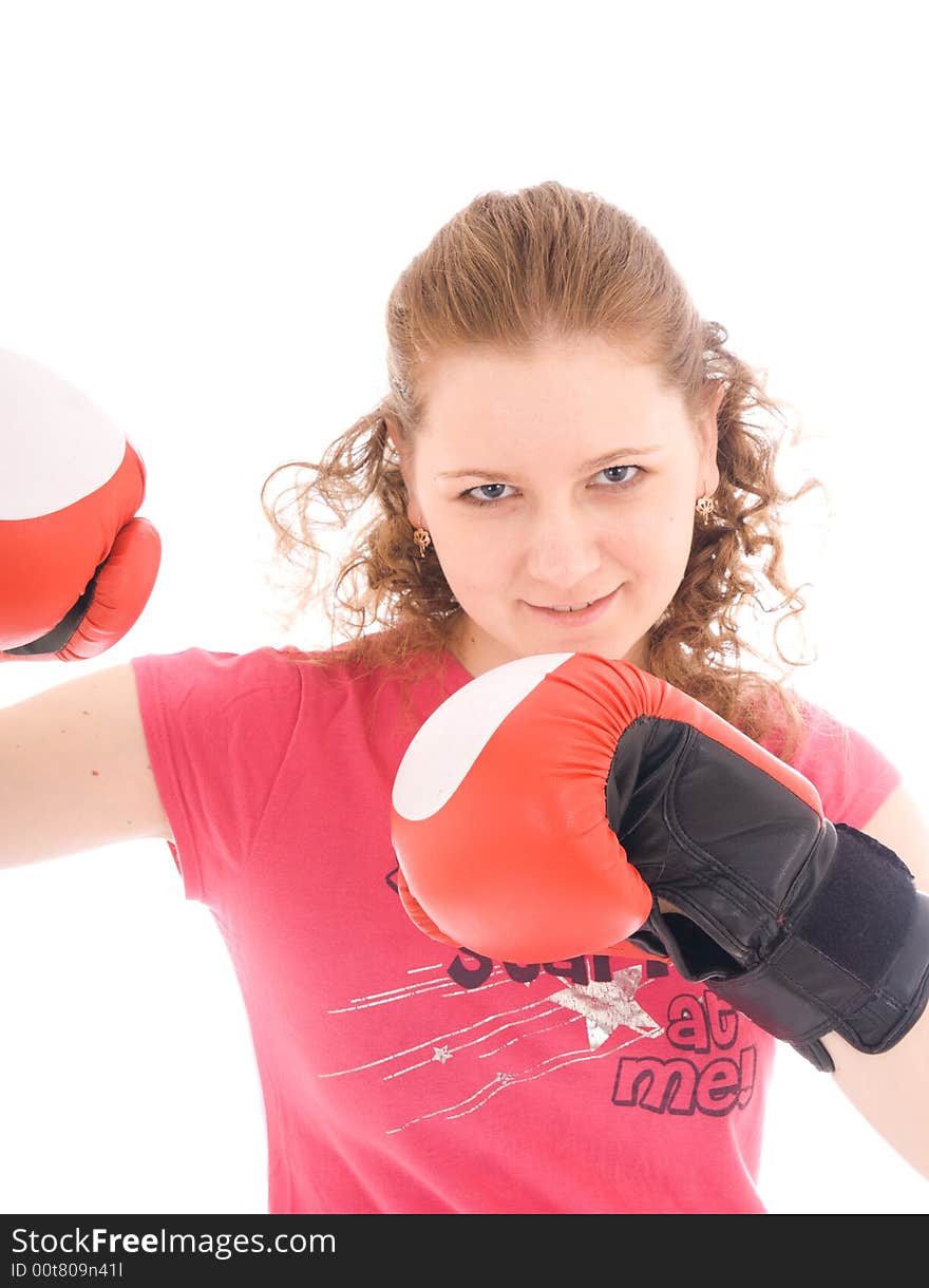 The young beautiful girl with boxing gloves isolated on a white background. The young beautiful girl with boxing gloves isolated on a white background