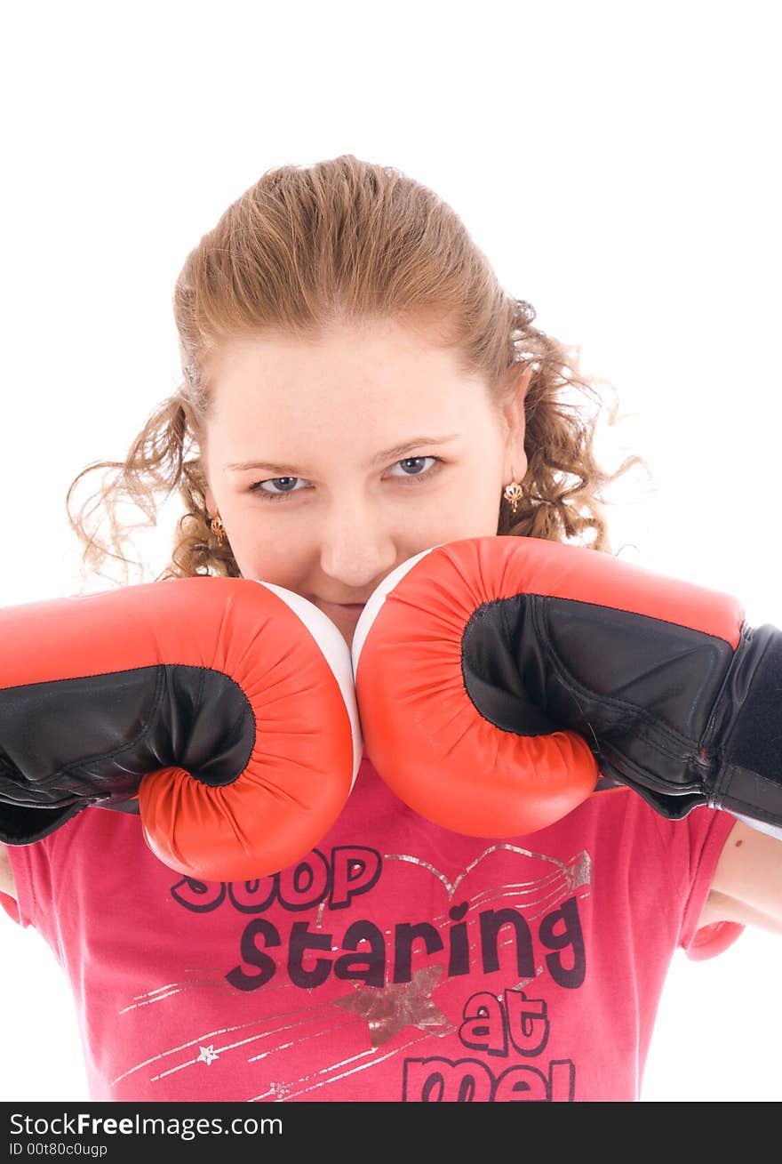 The young beautiful girl with boxing gloves isolated on a white background. The young beautiful girl with boxing gloves isolated on a white background