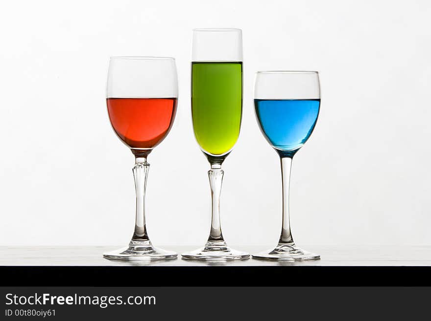 RGB glasses of wine isolated on white background