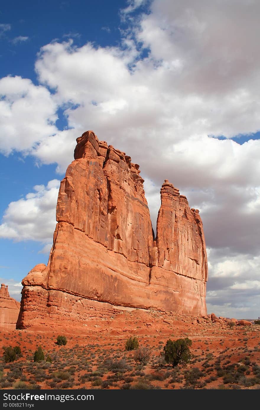 View of the red rock formations in Arches National Park with blue sky�s and clouds. View of the red rock formations in Arches National Park with blue sky�s and clouds