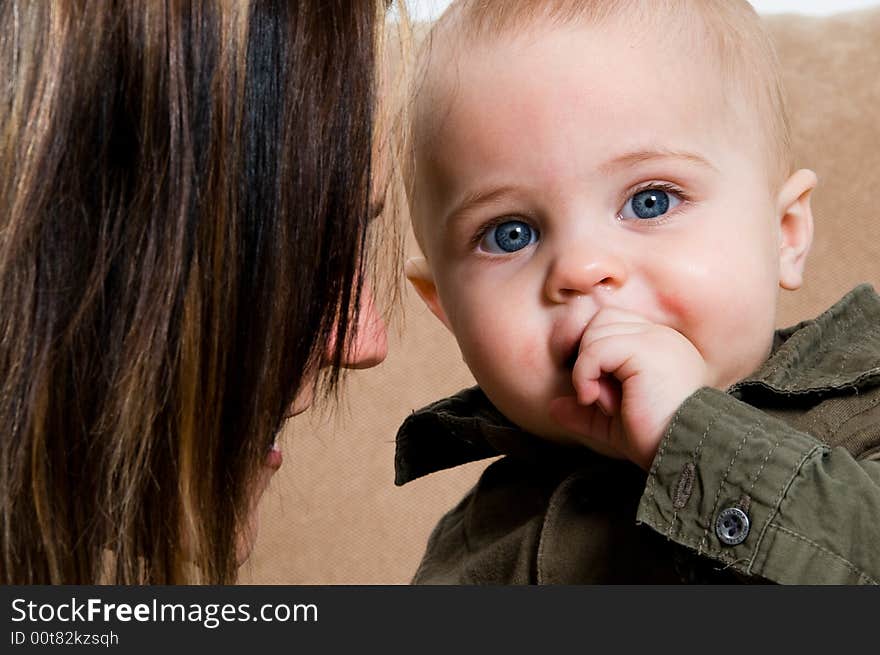 Mom happy with their baby boy blue eyes. Mom happy with their baby boy blue eyes