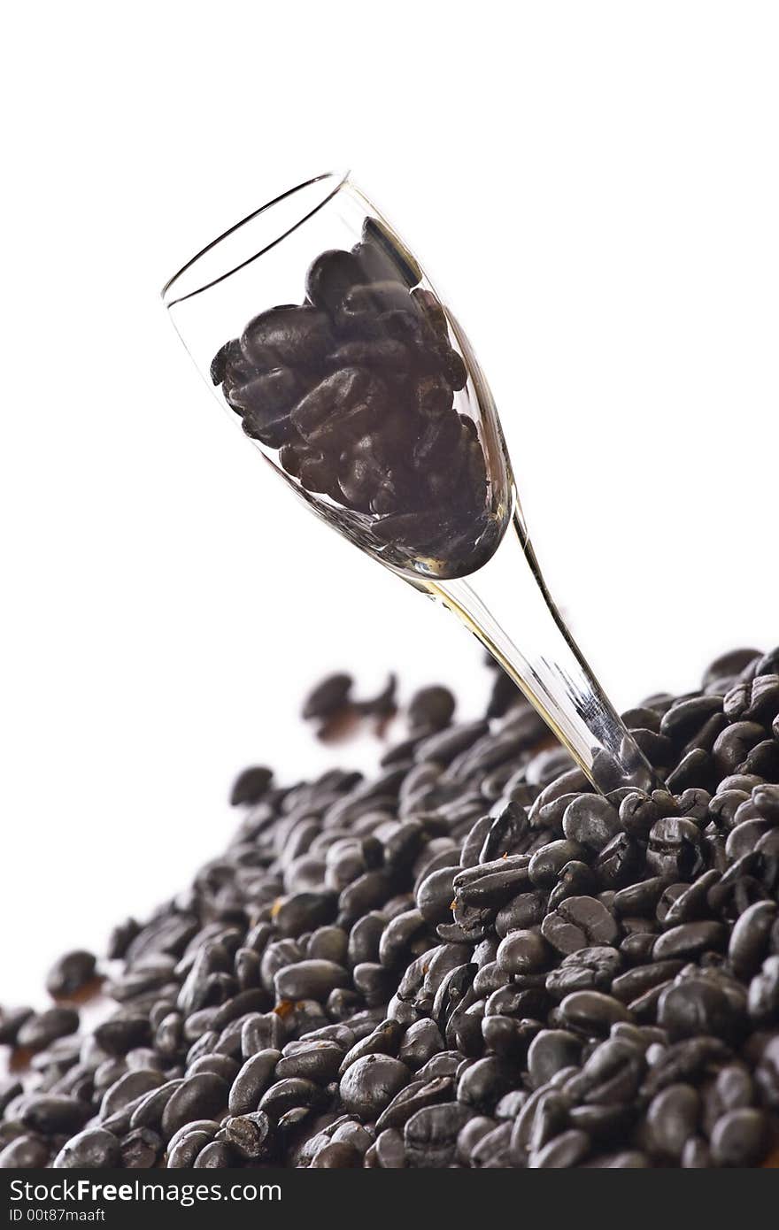 Spilled coffee beans isolated over white. Spilled coffee beans isolated over white