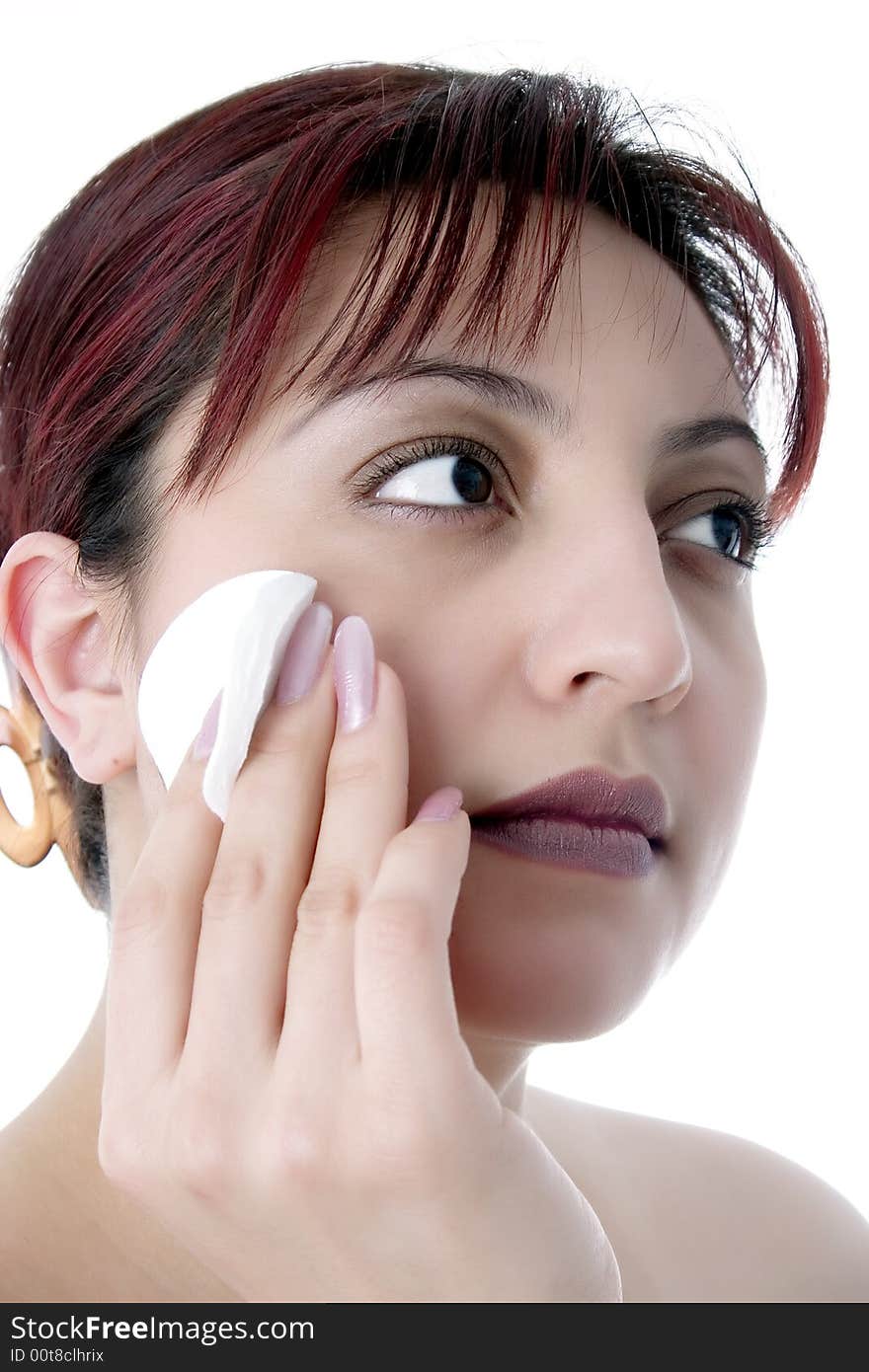 Cleaning face with cotton cosmetic pad