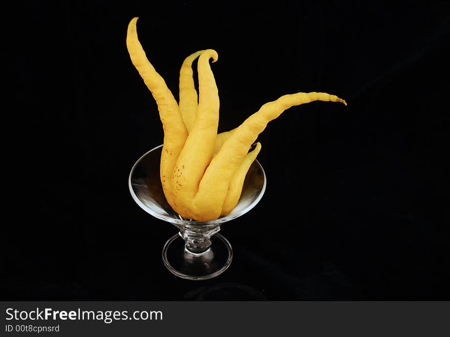 Strange organic lemon isolated by black background