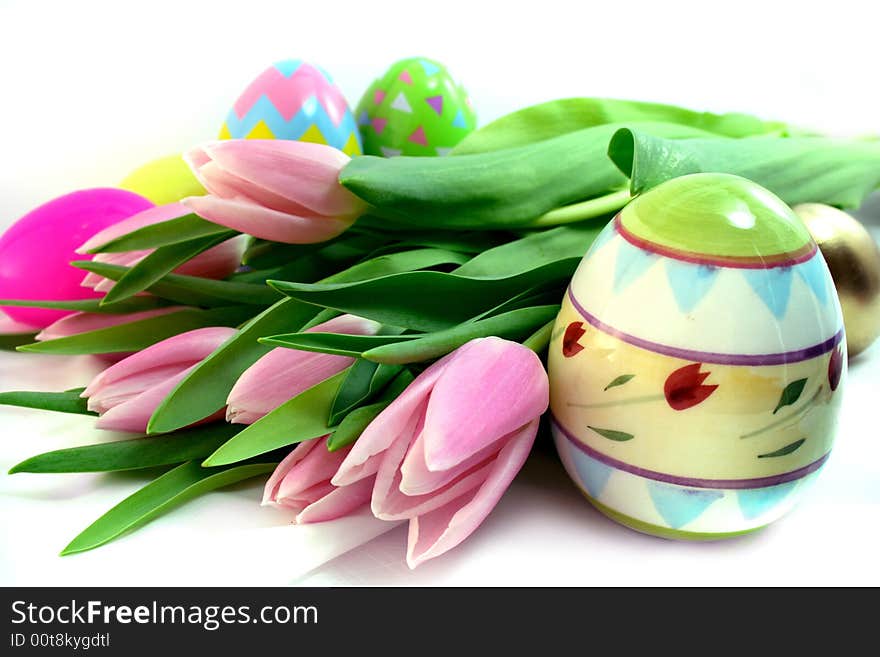 Colorful Easter eggs, tulips, bucket