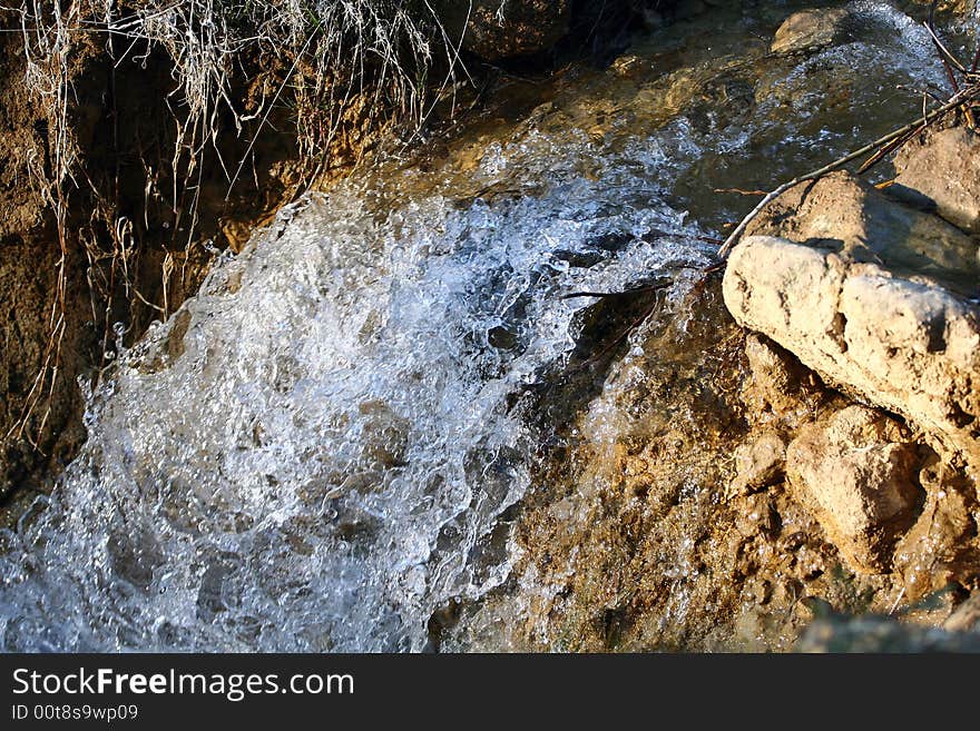 Stream of water falling downwards. Stream of water falling downwards