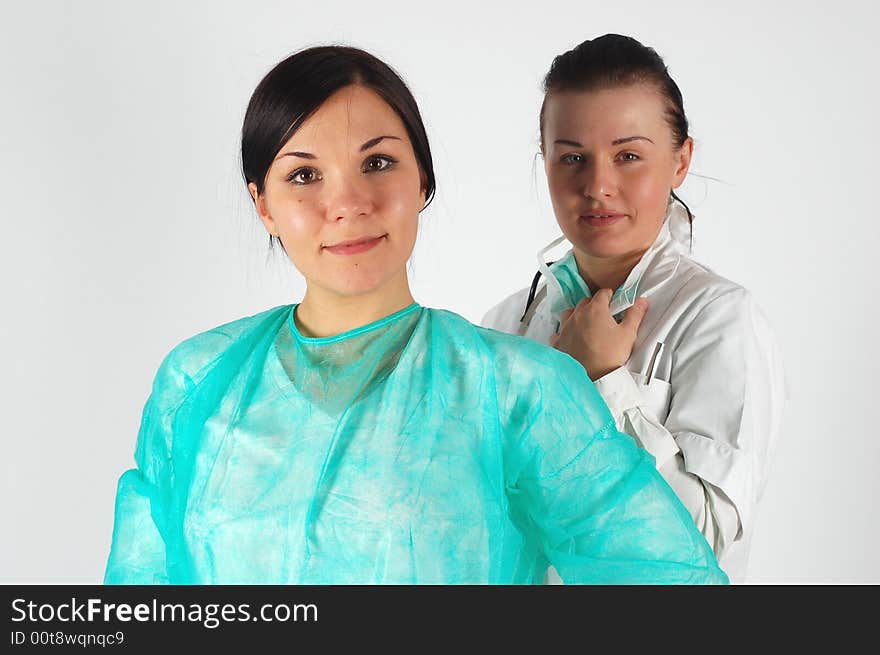 Two attractive brunette women in uniform. Two attractive brunette women in uniform