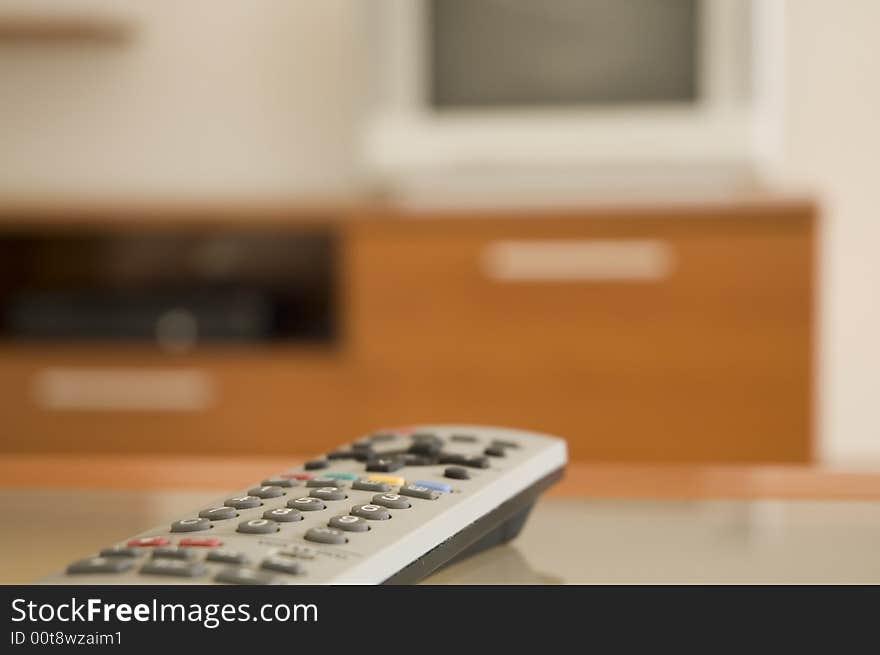 Remote controller at the table in front of the TV