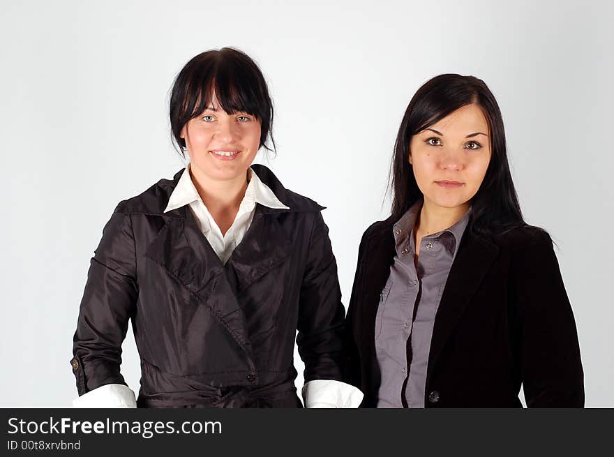 Two attractive brunette women in team. Two attractive brunette women in team