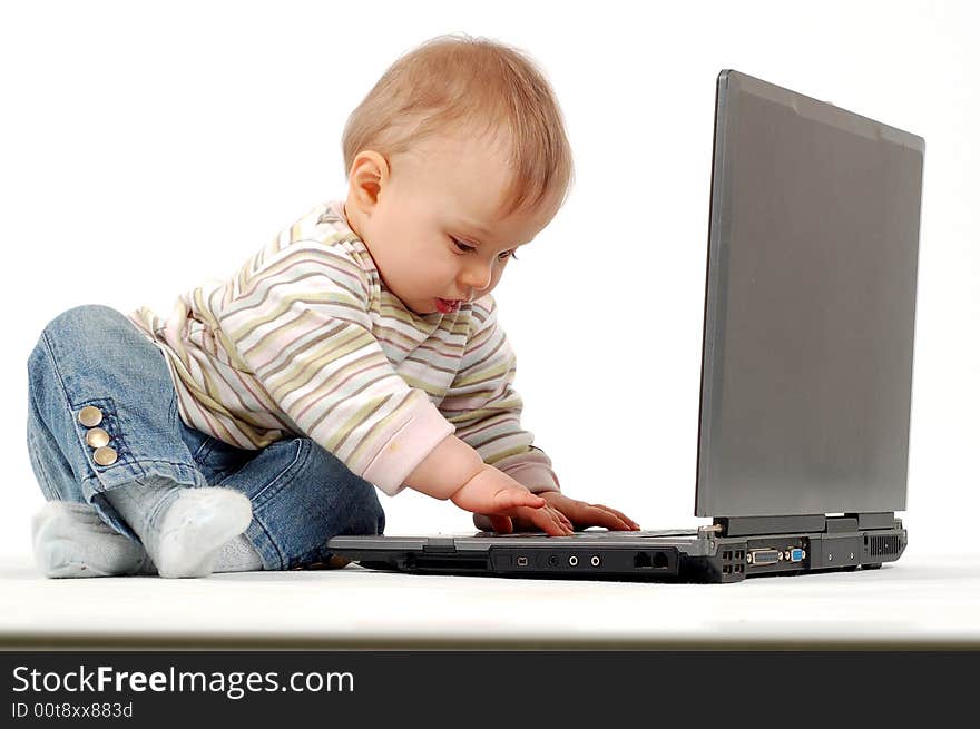 Baby having fun with laptop