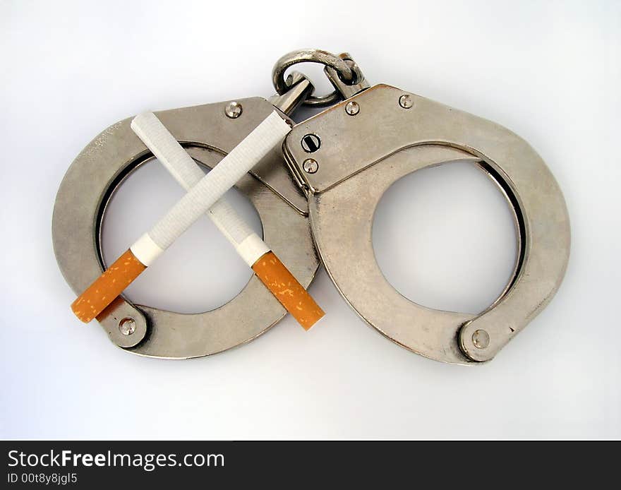 Shackles with cigarettes - lack of freedom. Shackles with cigarettes - lack of freedom.