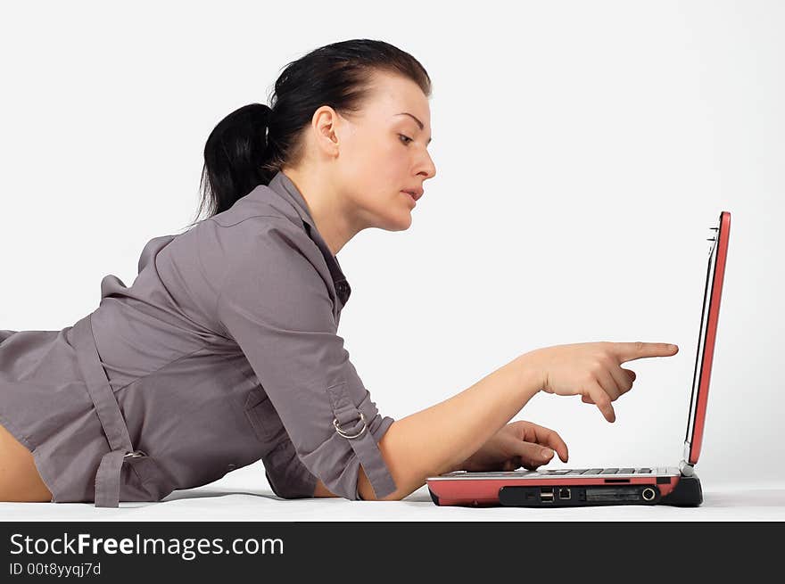 Attractive brunette woman with laptop on white background. Attractive brunette woman with laptop on white background