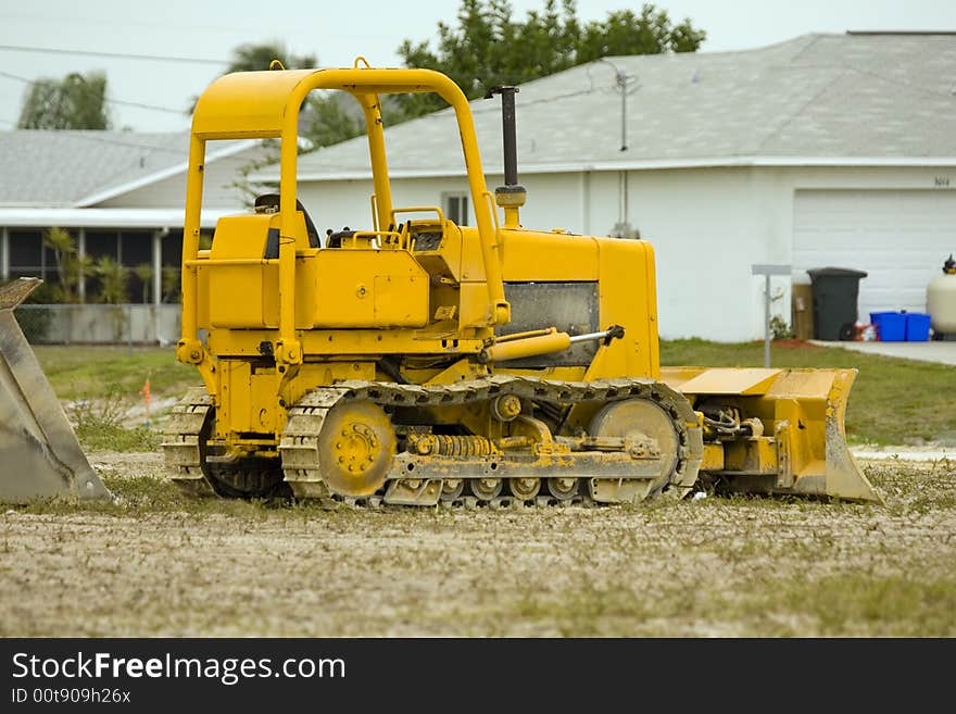 A small bulldozer at rest over the weekend